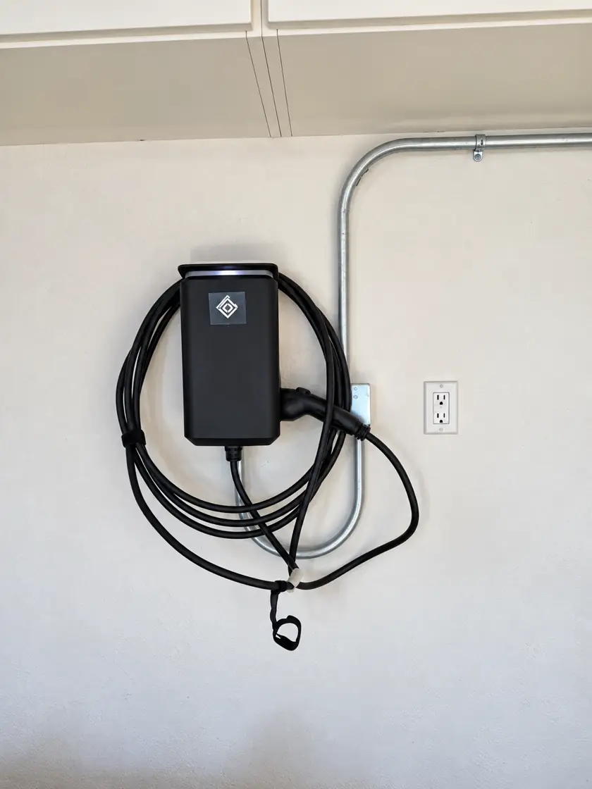 Level 2 EV charger with surface-mounted conduit in a garage