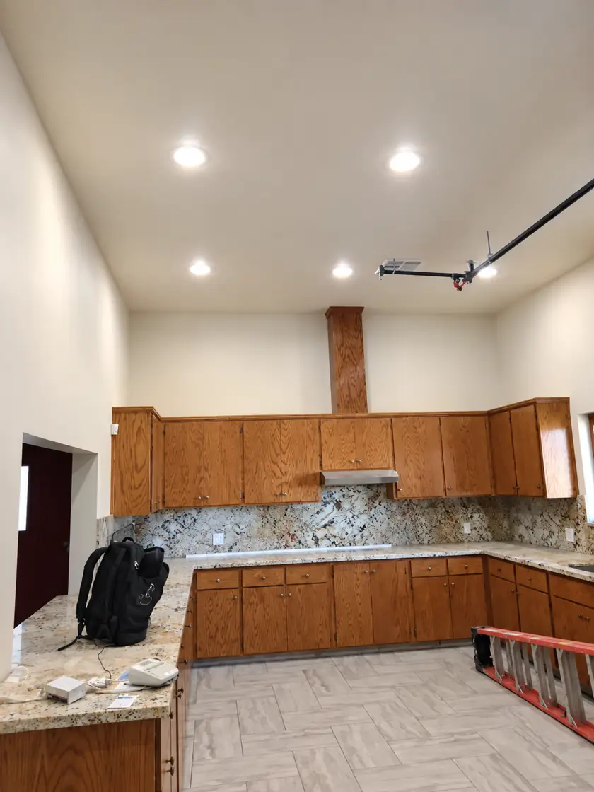 Recessed LED lights installed in a remodeled kitchen ceiling